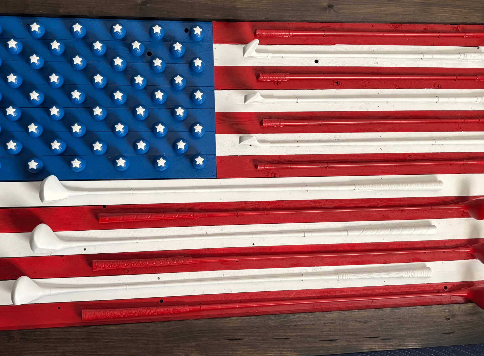Handcrafted American flag wall art made from reclaimed golf clubs and golf balls